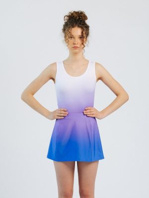 Front view of a custom team A-line skort, highlighting the structured panel construction and vibrant purple-to-blue gradient design for a professional dance or athletic uniform.
