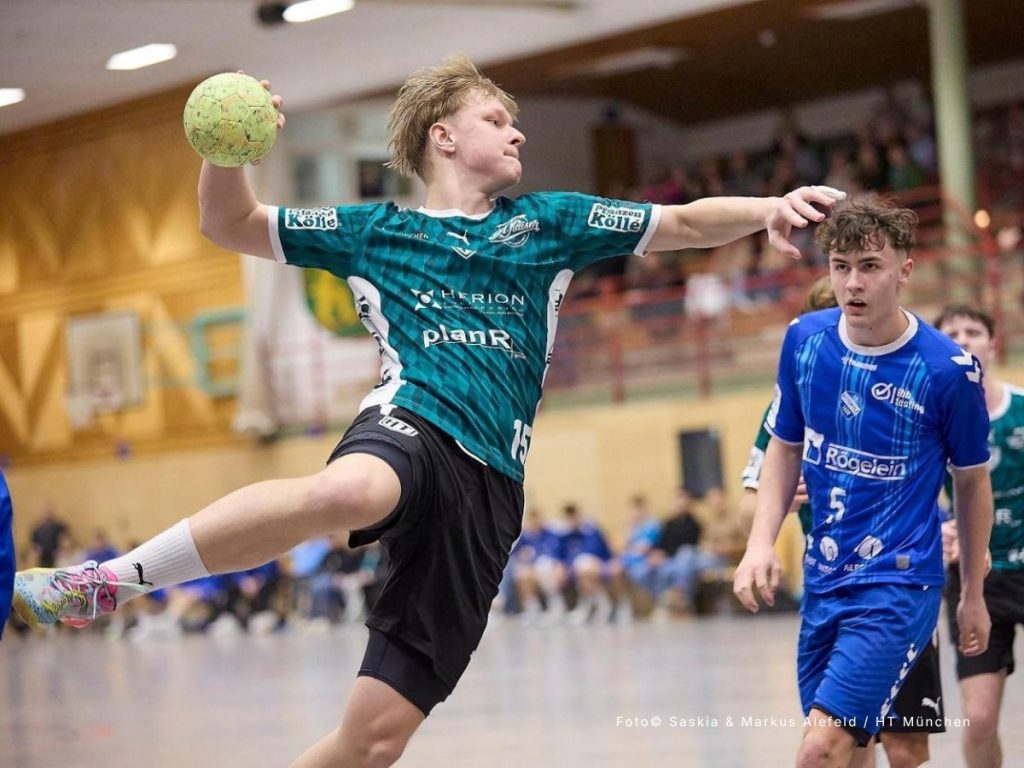 Action shot of a male HT München handball player mid-air in a teal custom patterned jersey